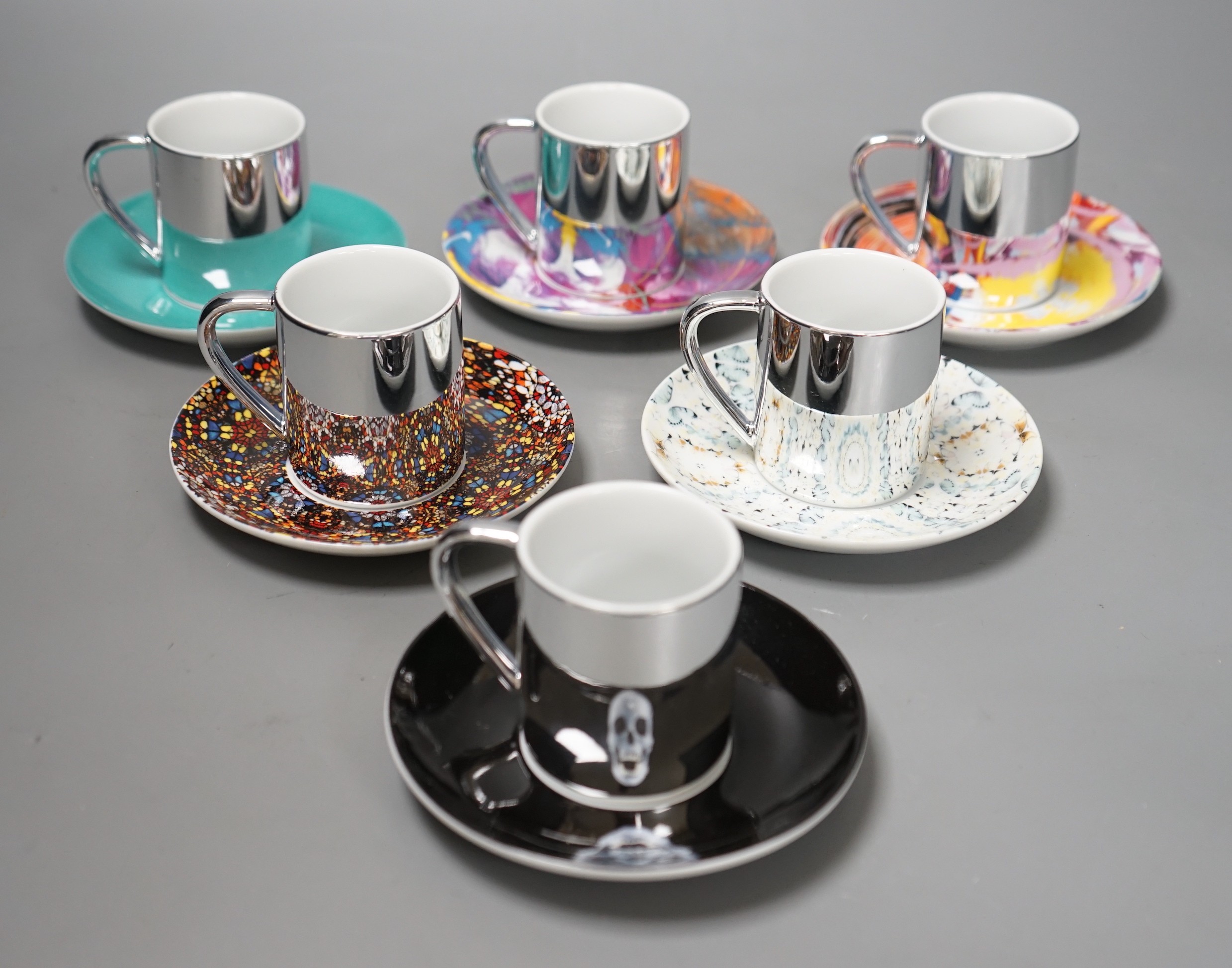 Damian Hirst, a set of six espresso cups and saucers; ‘Doorways to the Kingdom of Heaven’ 2007, ‘For the Love of God’ 2007, ‘The Incomplete Truth’ 2006, ‘Beautiful, cataclysmic pink minty shifting horizon exploding star